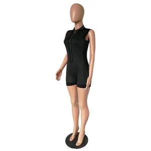 Detailed side view of black sleeveless rhinestone romper featuring a front zip closure