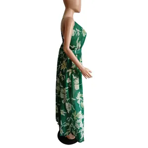 Side view of green floral chiffon maxi dress with deep V-neck and backless design