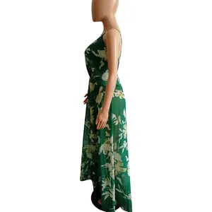 Side view of a green floral chiffon maxi dress with backless design on a mannequin