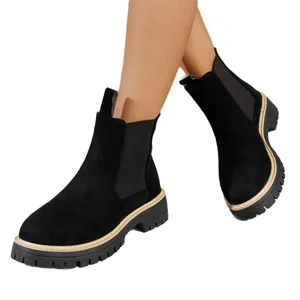 Women's black suede Chelsea boots with chunky lug sole and contrast stitching