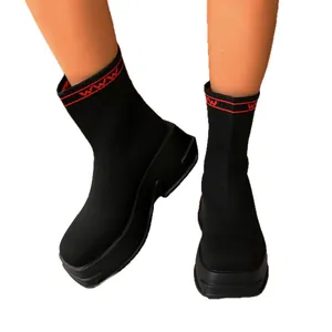 Black breathable knit sock boots featuring a thick platform sole and red ankle pattern.