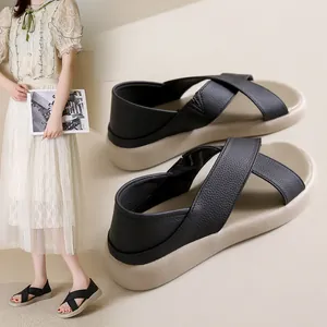 Lightweight black cross-strap sandals for women with comfortable flat beige sole