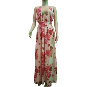 Detail of a floral chiffon maxi dress with a deep V-neckline and backless design.