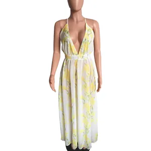 Front view detailing the deep V-neckline and yellow floral print on white chiffon