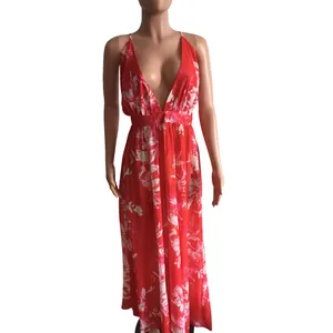Detailed macro view of the deep V-neckline on this red floral chiffon maxi dress.