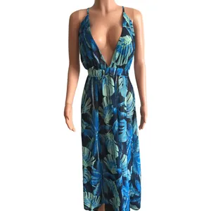 Detailed view of deep V-neck chiffon maxi dress with blue tropical leaf print
