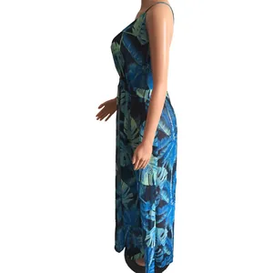 Side view of backless chiffon maxi dress with blue tropical leaf print on mannequin
