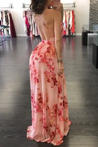 Detail of elegant backless floral chiffon maxi dress with criss-cross straps for women