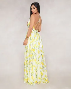 Detailed back view of a white chiffon maxi dress featuring vibrant yellow floral prints
