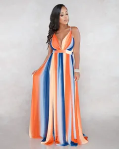 Full length view of a deep V-neck chiffon maxi dress with orange and blue gradient stripes.