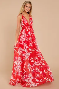 Detailed view of a red floral deep V-neck backless chiffon maxi dress on model.