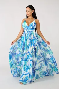 Detailed view of flowing deep V-neck chiffon maxi dress with blue tropical palm print
