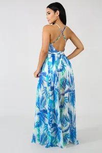 Back view of a blue tropical leaf print chiffon maxi dress featuring crisscross straps