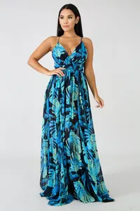 Detailed view of deep V-neck chiffon maxi dress with blue tropical leaf print.