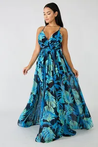 Full length detail of elegant chiffon maxi dress with deep V-neck and tropical leaf print