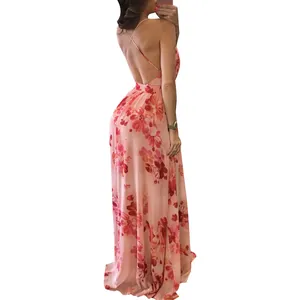 Detail of the elegant floral chiffon maxi dress showing the open back and cross straps.