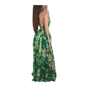 Detailed side view of an elegant green floral chiffon maxi dress with open back design