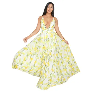 Full length view of a flowing deep V-neck chiffon maxi dress with yellow floral print