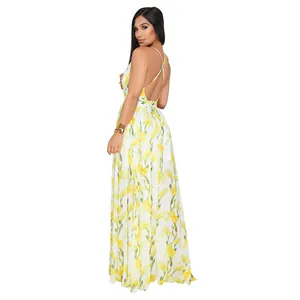 Back detail view of elegant white chiffon maxi dress with vibrant yellow floral print