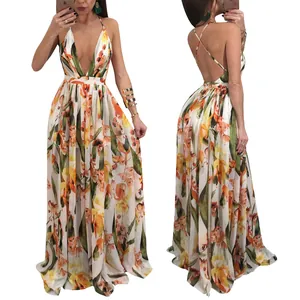 Detail view of the deep V-neck and backless design on a floral chiffon maxi dress.