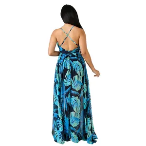 Rear view detail of backless chiffon maxi dress with cross-straps and leaf print