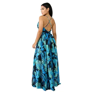 Back view of tropical leaf print chiffon maxi dress with crisscross back straps.