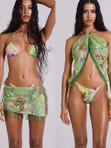 Detailed view of the floral beach set featuring a sequined mini skirt and bikini styling