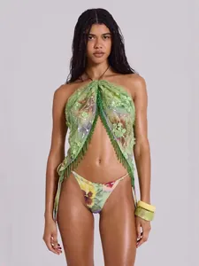 Fashionable green floral bikini set with sequin details and fringe for beach vacation