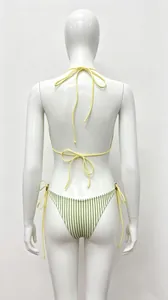 Vue arrière d'un bikini jaune à licou et bas rayé vert avec liens latéraux et perles.