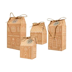 Close-up of festive kraft paper Christmas gift boxes in decorative gingerbread house shapes