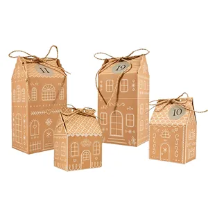 Gingerbread house shaped kraft paper Christmas candy boxes with twine bows and tags