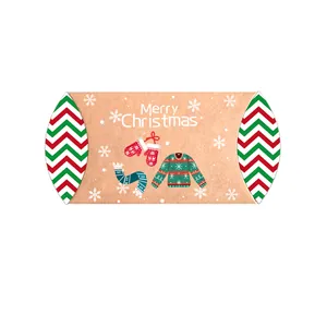 Vista frontale della confezione regalo di Natale in carta kraft con grafica festiva