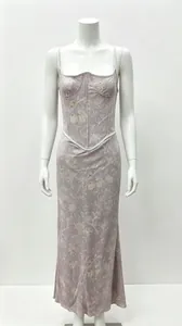 Close-up detail of the vintage floral print and corset-style bodice on this long dress