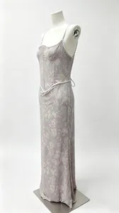 Elegant lilac floral print spaghetti strap corset maxi dress displayed on a studio mannequin
