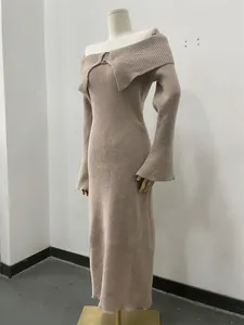 Close-up view of the elegant off-the-shoulder ribbed knit maxi dress in beige tone