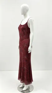 Floral print burgundy maxi dress featuring spaghetti straps and a corset bodice on a mannequin