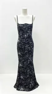 Detailed view of an elegant black floral print spaghetti strap maxi dress on a mannequin