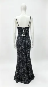 Back view of an elegant black lace-up maxi dress featuring a silver floral pattern print