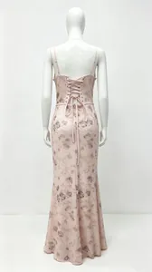 Back view of pink floral maxi dress with elegant lace-up detail on a white mannequin