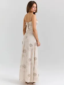Elegant French vintage maxi dress with floral embroidery and detailed lace-up back.