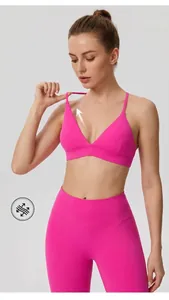 Close-up of high-elasticity pink sports bra showing stretchable strap detail