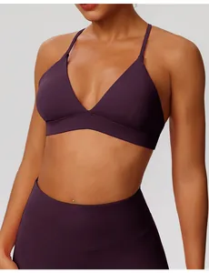 Detailed view of a plum purple quick-dry yoga sports bra and high-waist leggings set.