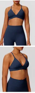 Detailed front and side view of navy blue sports bra and high-waisted yoga leggings