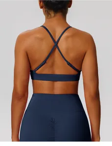 Back view of navy blue sports bra with elegant cross-strap design for yoga fitness