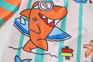 Close-up of colorful cartoon shark print on children's quick-dry one-piece swimwear