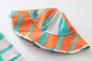 Detailed view of children's UV protection striped sun hat in orange and teal colors.