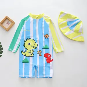 Light blue striped one-piece boys' swimsuit featuring cartoon dinosaur print and sun hat.