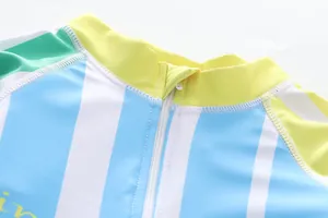 Detailed view of children's anti-UV swimsuit neckline with zipper and blue stripes