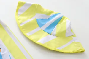 Macro detail of children's quick-dry sun swim hat featuring yellow and blue stripes