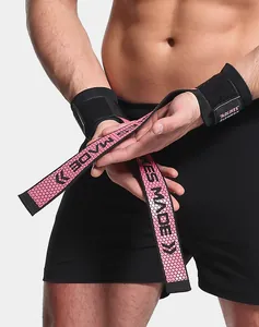Primo piano di cinghie di sollevaggio rosa con motivo a nido d'ape e supporto per polso.